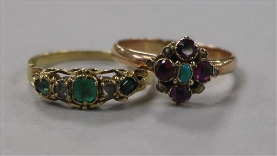 An early 20th century yellow metal and gem set Suffragette ring and a similar emerald and diamond set ring.